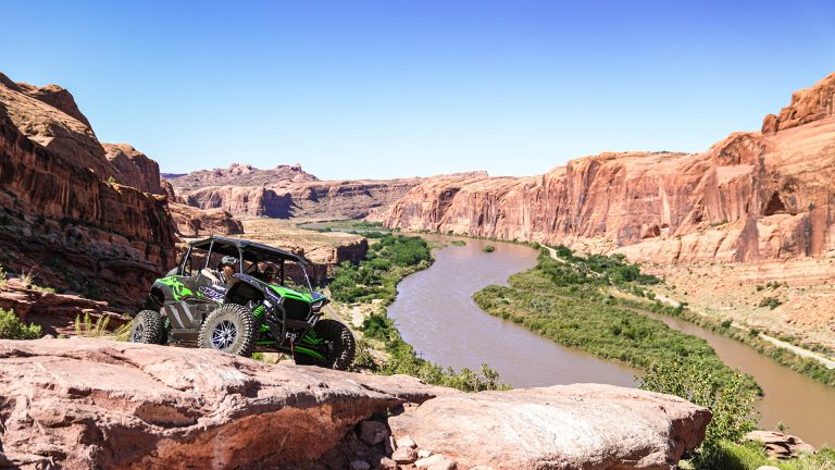 a green ATV tour with Moab UTV Tours, exploring off-road paths and enjoying the journey.